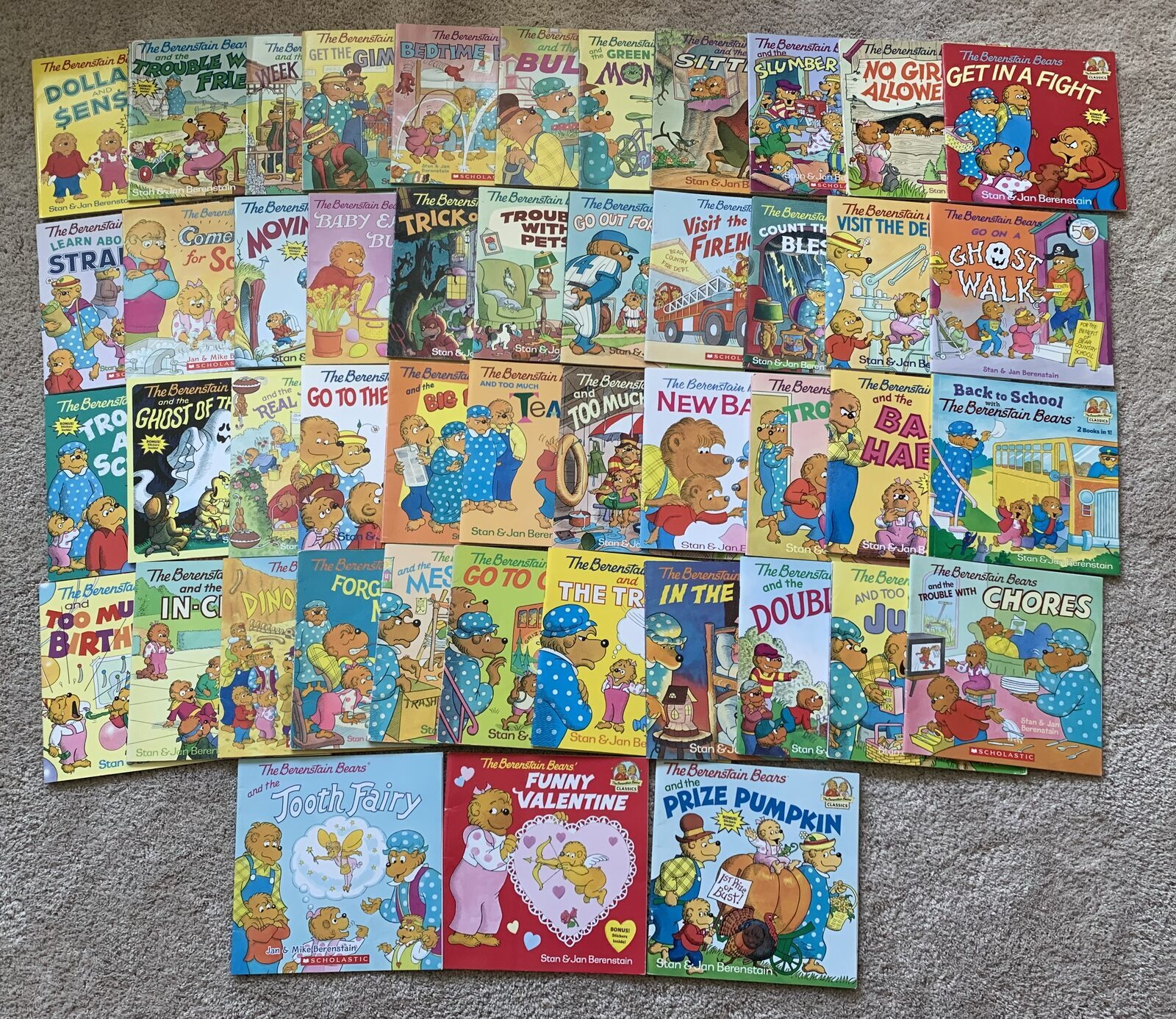 A large stack of Berenstain Bears books laid out on the floor