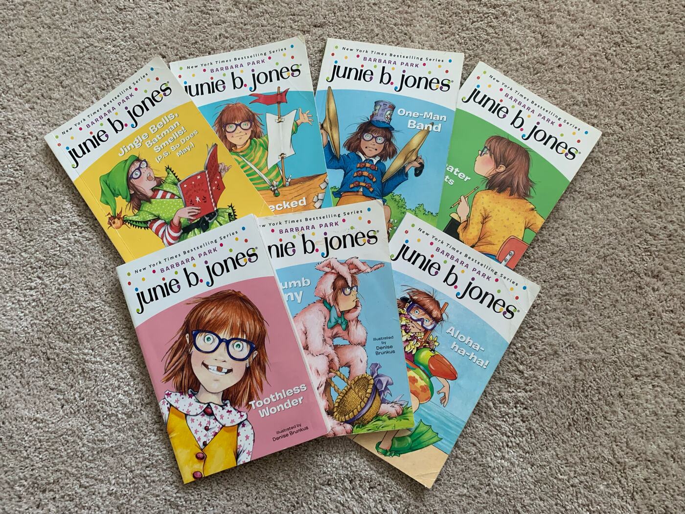 Seven Junie B. Jones paperbacks fanned out on the carpet